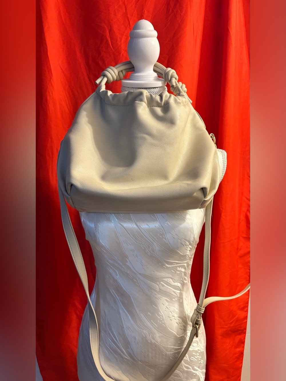 Cream Soft hand bag with crossbody strap with Top Knot Handle